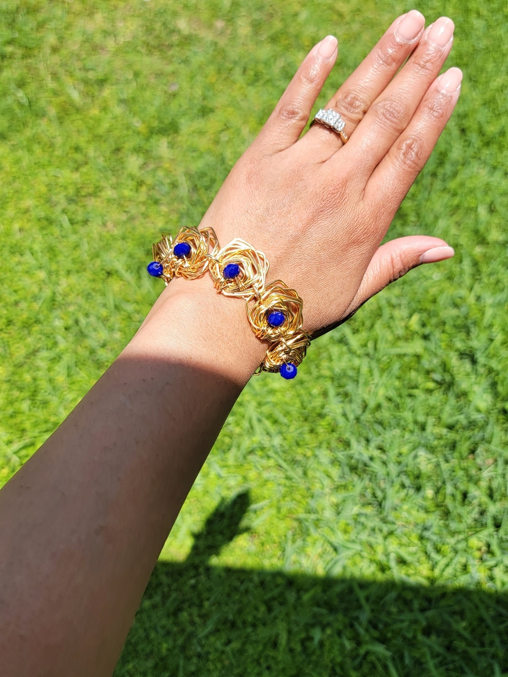 Gold Wire Geometric Bracelet with Blue Bead Accents